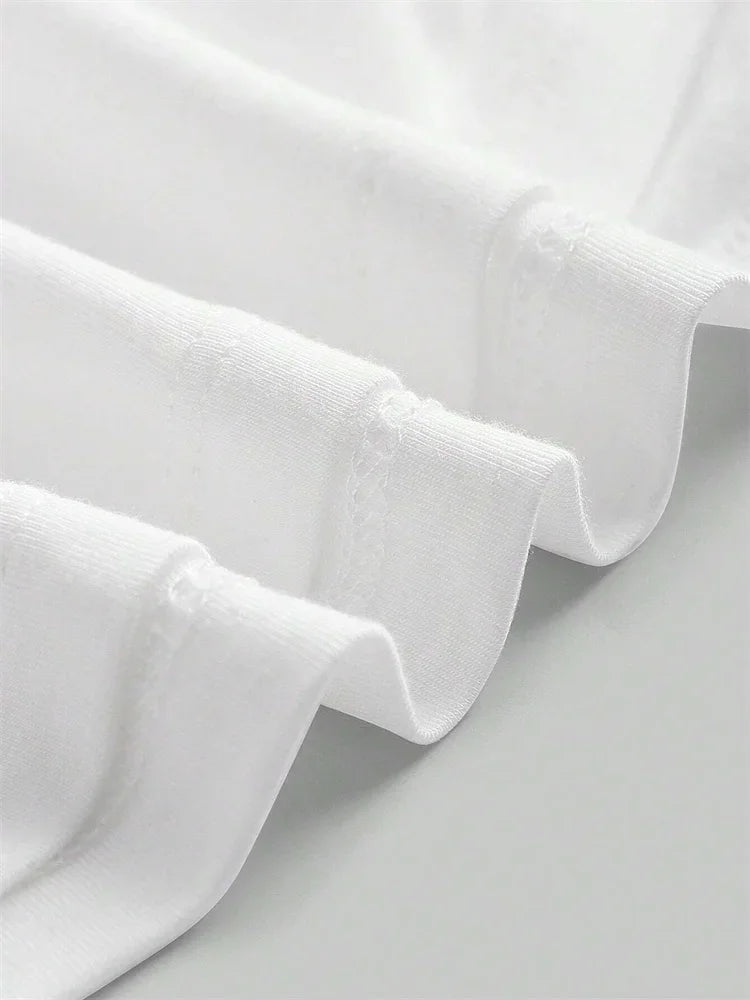 Close-up of white fabric with a soft texture on a light gray background